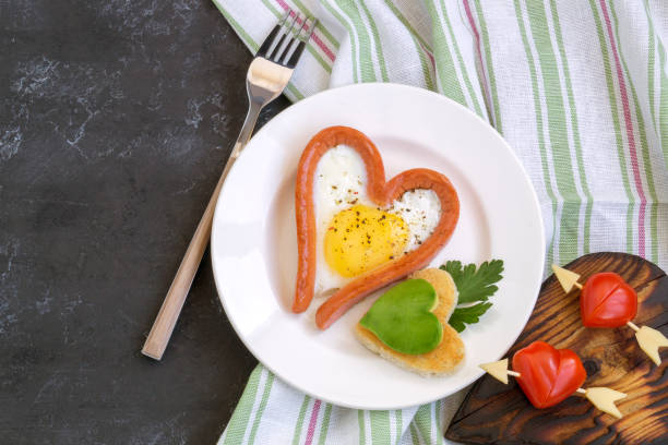 istock Valentine's day Breakfast is scrambled eggs with heart-shaped bread. The view from the top 1195530825