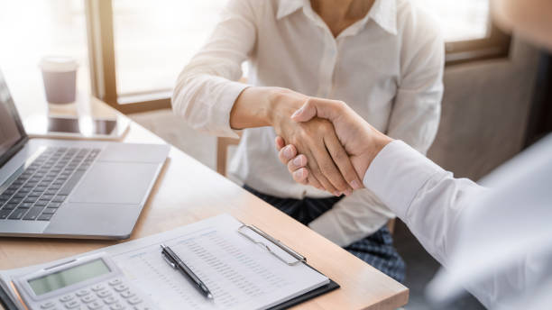 istock Business partnership hand shaking successful commerce dealing. 1195532400