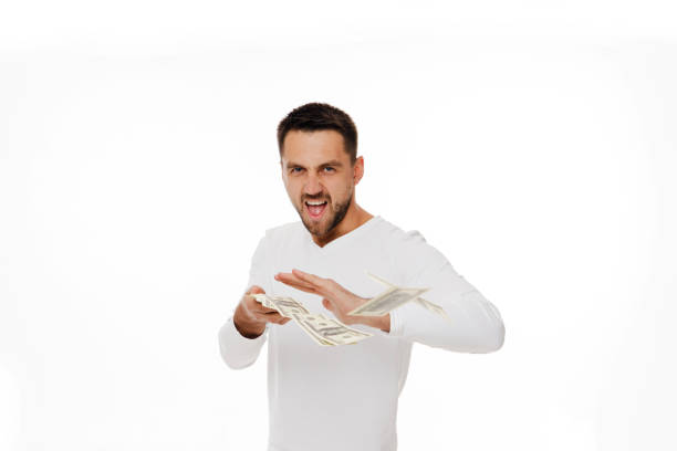 istock man throwing out money banknotes 1195532807