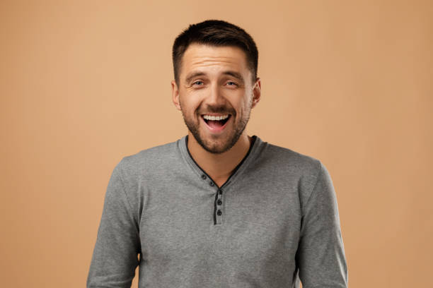 istock smiling handsome bearded man on white background 1195533038