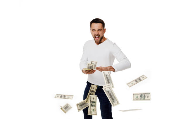 istock man throwing out money banknotes 1195533597