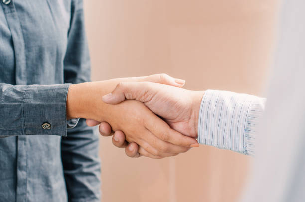istock Business partnership hand shaking successful commerce dealing. 1195538592