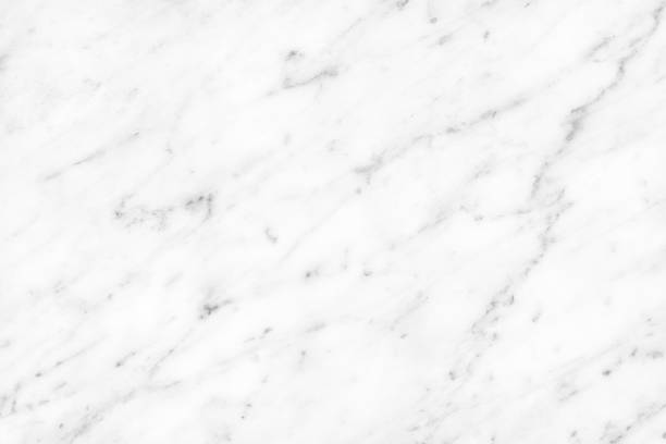 istock White Carrara Marble natural light surface for bathroom or kitchen countertop 1195539354