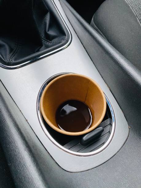 istock Cup Holder with coffee in a car 1195542563