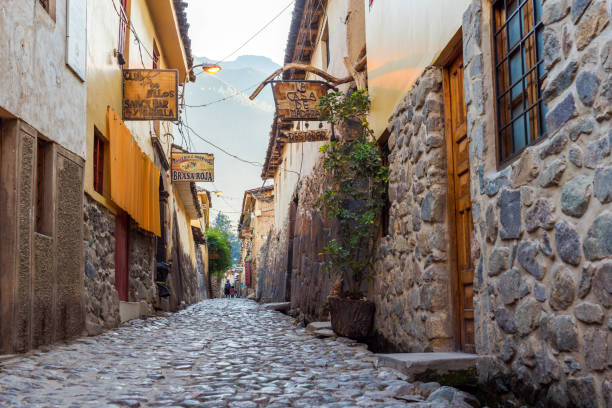 View of the narrow city street in the historical part of the city, Ollantaytambo, Peru. stock photo