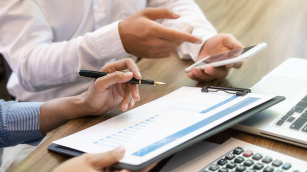 istock Business team brainstorming and discussing with financial data and report graph. Teamwork meeting working concept. 1195544228