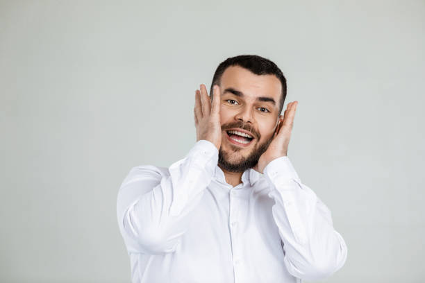 istock surprised handsome bearded man with shocked facial expression 1195545134