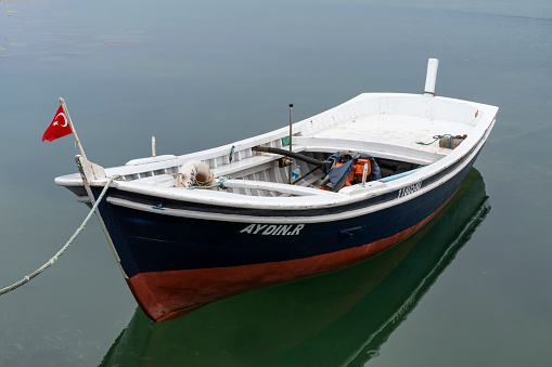 Evrenye, Turkey - May 2, 2019: Wooden, white fishing ship in the harbor of Evrenye at the Black Sea.