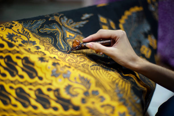 Making Batik Tulis Closeup Hand Painting Batik on the Fabric batik indonesia stock pictures, royalty-free photos & images