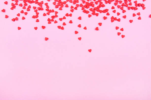 istock Pink background with red hearts. Valentine's day concept. 1195548908