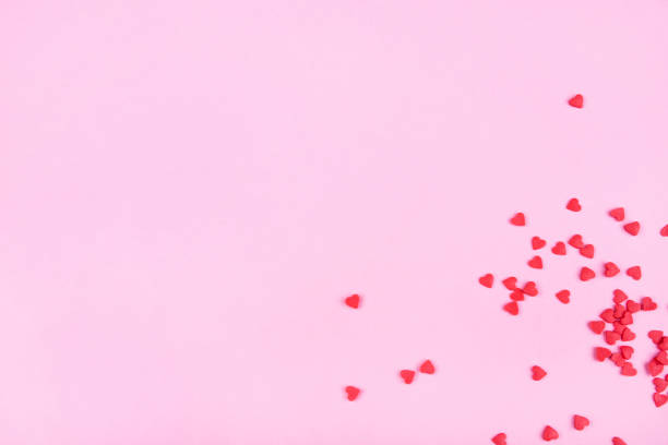 istock Pink background with red hearts. Valentine's day concept. 1195548909