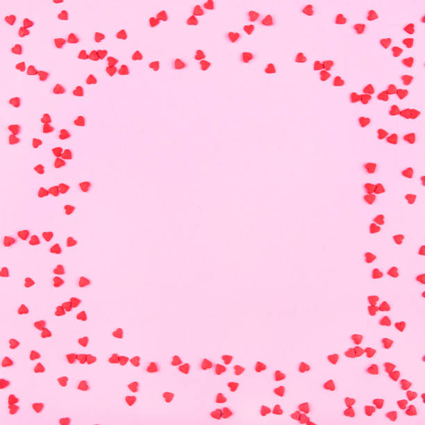 pink background with red hearts. valentine's day concept. - heart shape confetti small red imagens e fotografias de stock