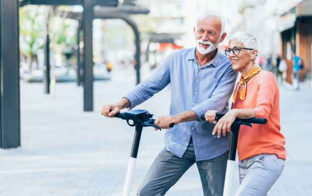 istock Modern senior couple with electric scooter 1195549159