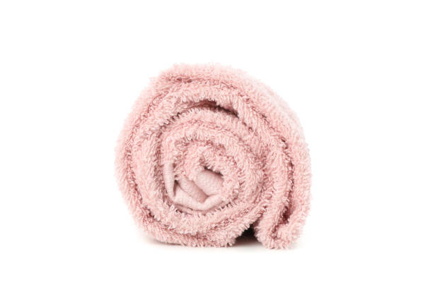 istock Rolled pink towel isolated on white background, close up 1195550918