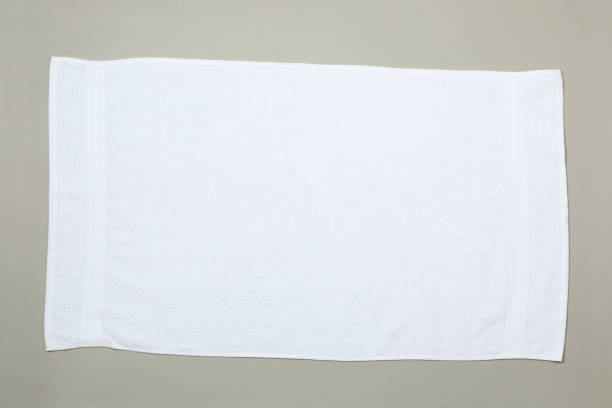 istock White towel isolated on grey background, top view 1195552118