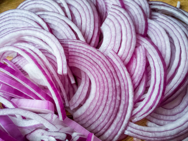 Onion slices closeup Onion slices closeup spanish onion stock pictures, royalty-free photos & images