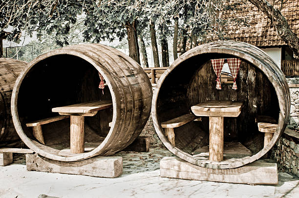 Wooden barrel in ethnic restaurant, with chair and table for guest