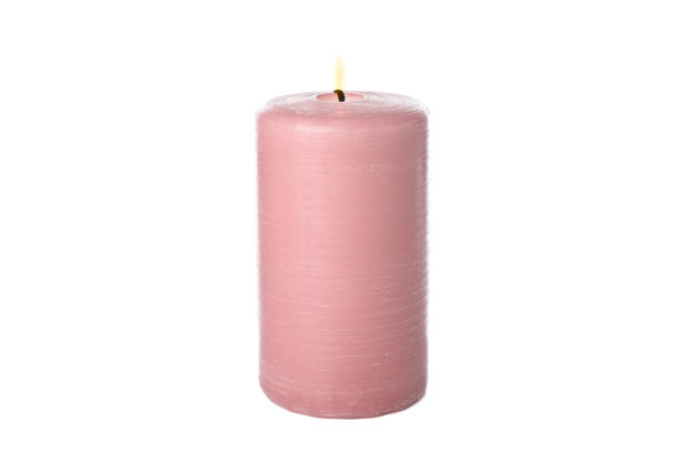 istock Pink burning candle isolated on white background 1195555845
