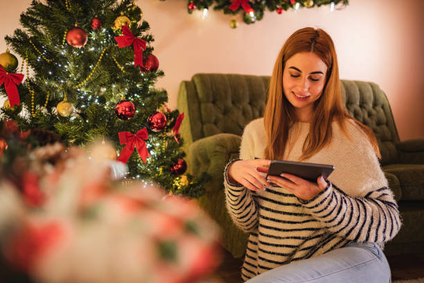 istock Woman using digital tablet for Christmas 1195555850
