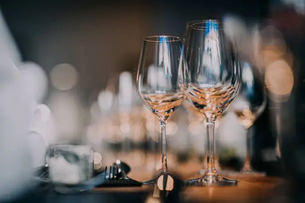 Wedding dinner table with empty glasses