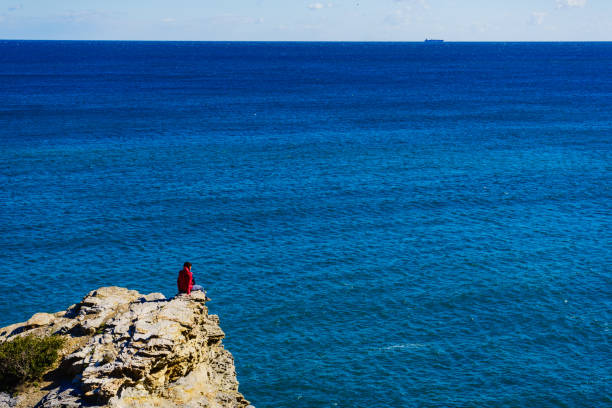 istock Tourist woman on sea cliffs in Spain 1195558913