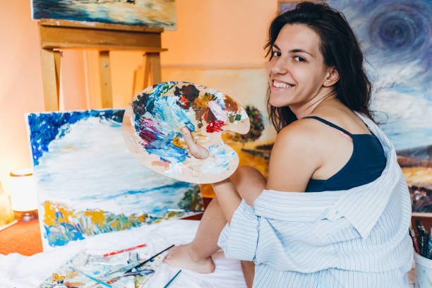 istock Woman painter working on her art 1195559300