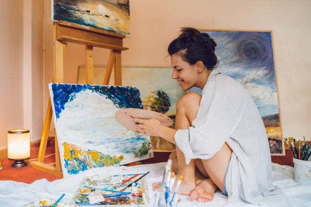 istock Woman painter working on her art 1195559909