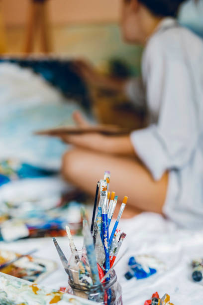 istock Woman painter working on her art 1195559947