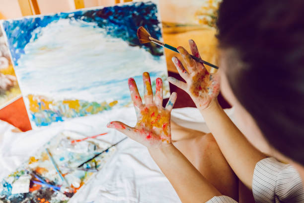 istock Woman painter dirty hands 1195560170