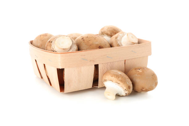 istock Champignon mushrooms in container isolated on white background 1195560700