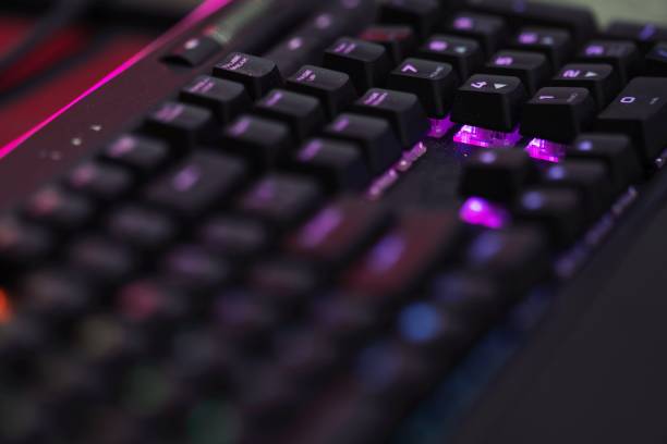 istock Close up of Computer RGB gaming keyboard, Illuminated by colored LED 1195561251