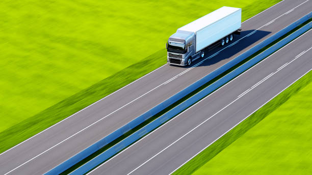 istock semi-truck with trailer driving on road 1195563786