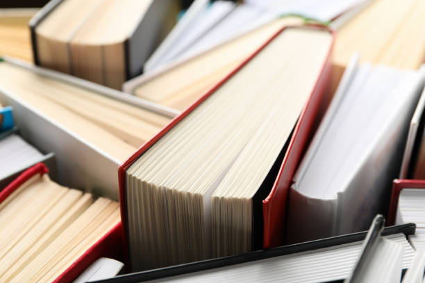 istock Many books on whole background, close up. Study concept 1195563827