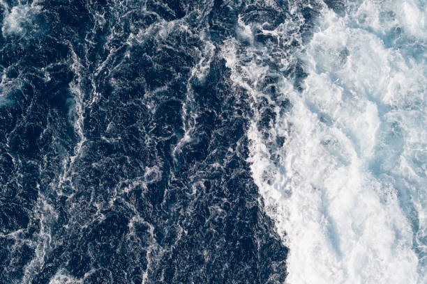 istock Full frame dark blue turbulent sea water backgrounds 1195565204