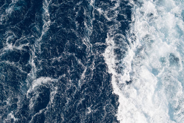 Full frame dark blue turbulent sea water backgrounds