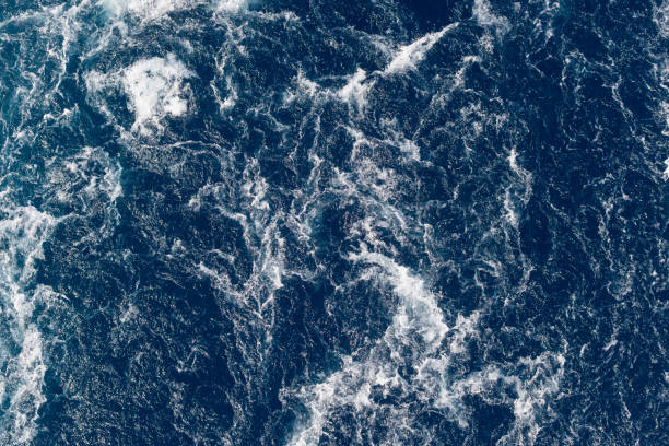 istock Full frame dark blue turbulent sea water backgrounds 1195565908