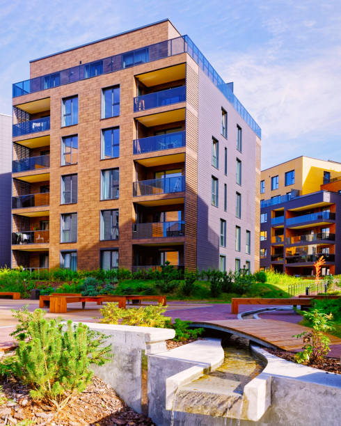 istock Fountain at Modern complex of residential buildings reflex 1195566185