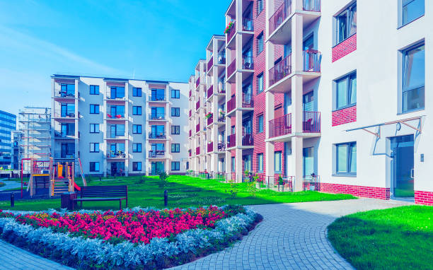 istock New residential buildings with flowerpot reflex 1195567670