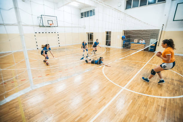 istock Female volleyball player digs 1195568761