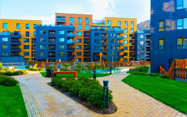 istock Modern new residential apartment house building complex outdoor facilities bench reflex 1195569730