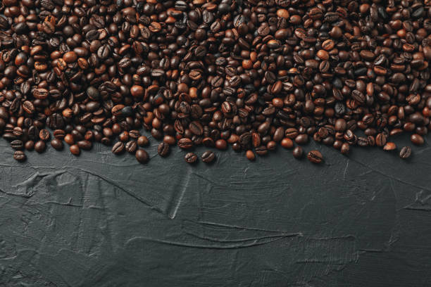 istock Frame of coffee beans on black background, space for text 1195569901