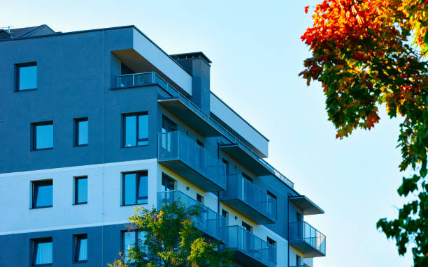 istock Facade of modern apartment house copy space autumn tree reflex 1195569926