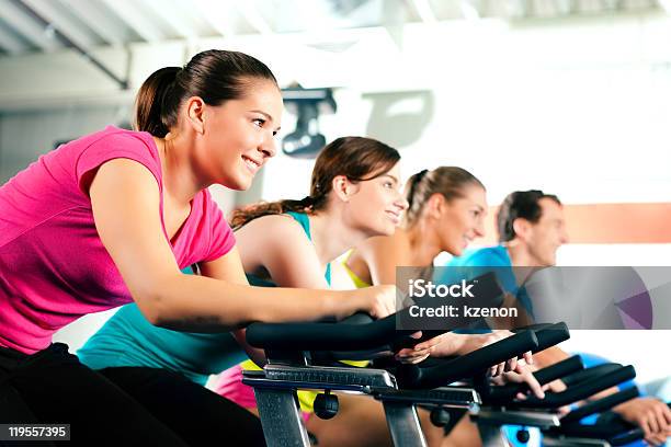 Indoor Bycicle Cycling In Gym Stock Photo - Download Image Now - Cycling, Gym, Health Club