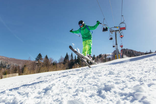 istock Young athlete freestyle Skier having fun while running downhill in beautiful landscape on sunny day during winter season 1195573955
