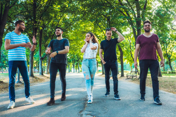 istock Friends walking in park 1195574781