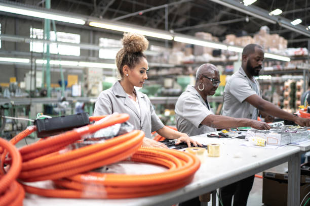 istock Team working together in a factory 1195574868