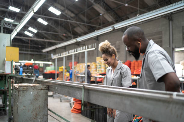 istock Team working together in a factory 1195574878