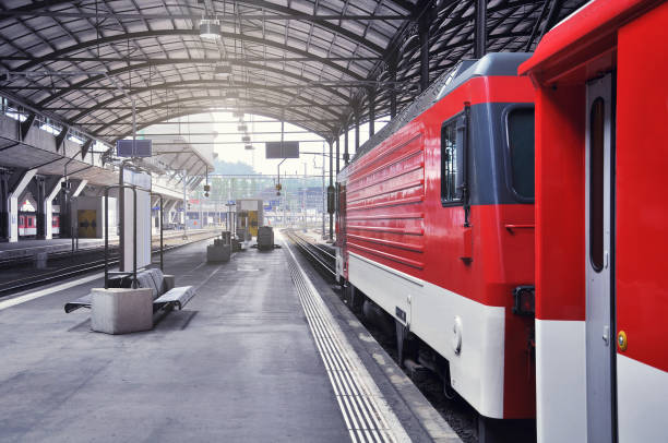 istock Passenger train stands by the station platform before departure. 1195576068