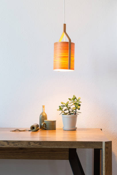 istock turn on wooden lamp over the table 1195577158