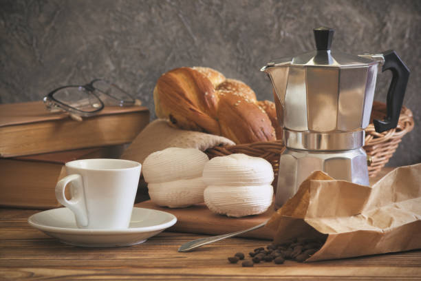 istock Coffee maker with cup and sweet zephyr dessert. 1195578923
